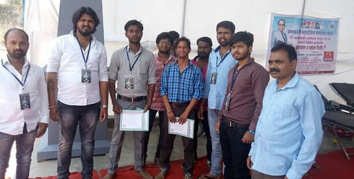 Group of volunteers with certificates